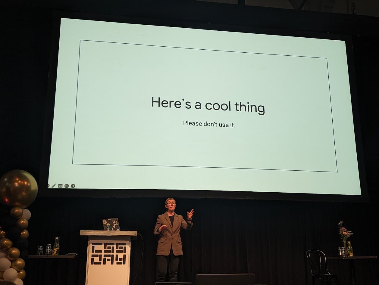 Rachel Andrew in front of a slide with text: Here is a cool thing, please don't use it