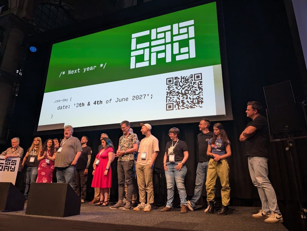 All CSS Day 2026 speakers on stage at the end of the conference with the CSS Day logo and next year's date on screen
